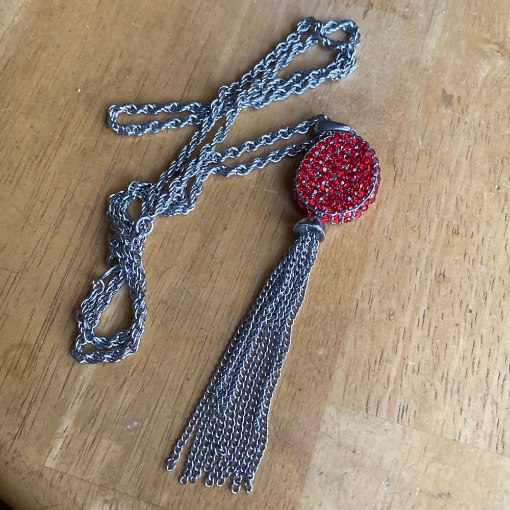 V! Silver tone necklace with charm in good condition